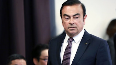 In this May 12, 2016, photo, then Nissan Motor Co. President and CEO Carlos Ghosn attends a joint press conference with Mitsubishi Motors Corp. in Yokohama.