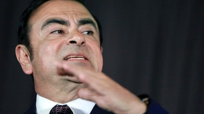 In this May 12, 2016, photo, then Nissan Motor Co. President and CEO Carlos Ghosn speaks during a joint press conference with Mitsubishi Motors Corp. in Yokohama.