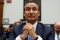 In this May 2, 2017 file photo, United Airlines CEO Oscar Munoz prepares to testify on Capitol Hill in Washington.