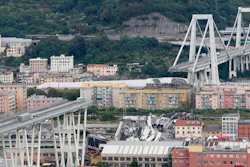 In this Tuesday, Aug. 14, 2018 file photo cars are blocked on the Morandi highway bridge after a section of it collapsed, in Genoa, northern Italy.