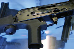 In this Oct. 4, 2017 file photo, a bump stock is attached to a semi-automatic rifle at the Gun Vault store and shooting range in South Jordan, Utah.