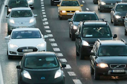 In this Nov. 26, 2014 file photo electric cars queue in the bus lane, left, on the main road into Oslo, Norway.