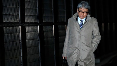 Motonari Otsuru, defense lawyer of former Nissan chairman Carlos Ghosn, leaves from Tokyo Detention Center, Thursday, Dec. 20, 2018.