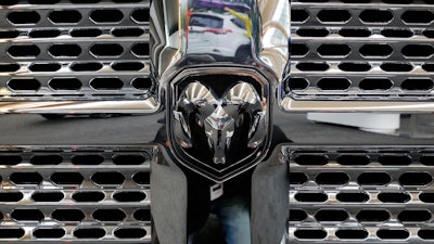 This Feb. 15, 2018, file photo, shows Ram logo on the grill of a Ram truck on display at the Pittsburgh Auto Show.