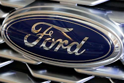 This Feb. 15, 2018 photo shows a Ford logo on display at the Pittsburgh Auto Show.
