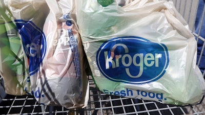 This June 15, 2017, file photo shows bagged purchases from the Kroger grocery store in Flowood, Miss.