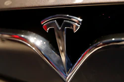 This Oct. 3, 2018, file photo shows a Tesla emblem at the Auto show in Paris.
