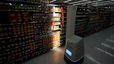 In this Nov. 9, 2018, file photo, a Bossa Nova robot scans shelves at a Walmart Supercenter in Houston.