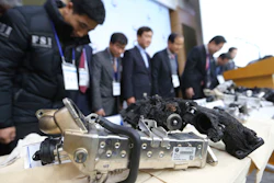 Transport Ministry officials and members of the investigative panel on BMW bow during a press conference in Seoul.