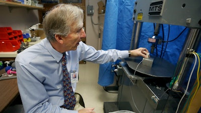 In this Dec. 17, 2018 photo, John Szivek of the University of Arizona explains how the scaffold made from a 3-D printer is tested.