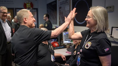 New Horizons principal investigator Alan Stern and mission operations manager Alice Bowman after the team received signals from the spacecraft Tuesday, Jan. 1, 2019.