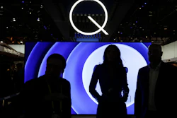 In this Jan. 6, 2017, file photo attendees stand in front of a QLED TV at the Samsung booth during CES International in Las Vegas.