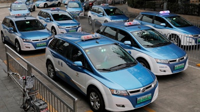 In this Monday, Jan. 7, 2019, photo, new electric-powered taxis are seen in Shenzhen city, south China's Guangdong province.