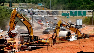 In this May 31, 2017 photo, traffic travels along Interstate 235 near a construction project in Oklahoma City, Okla.