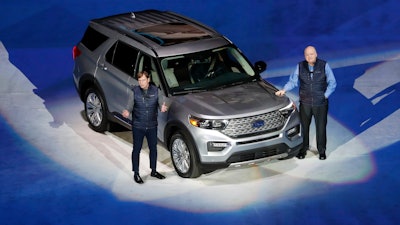 Ford Motor Co. President, Global Markets Jim Farley and President and CEO Jim Hackett stand next to the redesigned 2020 Ford Explorer, Wednesday, Jan. 9, 2019, in Detroit.