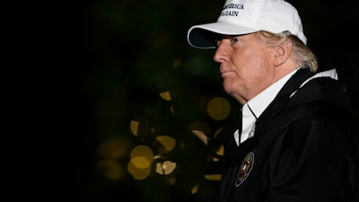 President Donald Trump walks on the South Lawn of the White House in Washington, Thursday, Jan. 10, 2019.