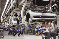 In this July 12, 2013, file photo, employees at the Volkswagen plant in Chattanooga, Tenn., work on the assembly of Passat sedans.