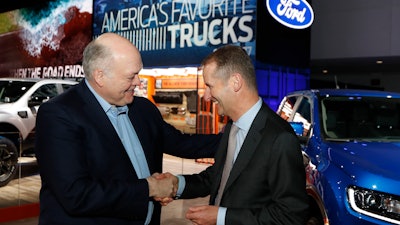Ford President and CEO Jim Hackett, left, meets with Dr. Herbert Diess, CEO of Volkswagen AG, Monday, Jan. 14, 2019, in Detroit.