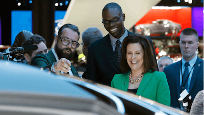 Pontus Fontaeus, executive design director of GAC Motors, tells Michigan Gov. Gretchen Whitmer and Lt. Gov. Garlin Gilchrist II the features of the company's concept vehicle, Tuesday, Jan. 15, 2019, at the North American International Auto Show in Detroit.