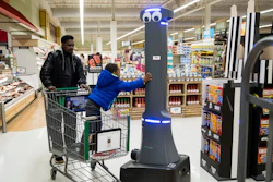 William Rucker and his grandson Justice, 4, say hello to a robot named Marty as it cleans the floors at a Giant grocery store in Harrisburg, Pa., Tuesday, Jan. 15, 2019.
