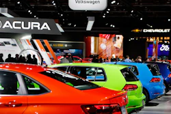 Signage for automakers Volkswagen, Acura, Chevrolet and Ford, Tuesday, Jan. 15, 2019, at the North American International Auto Show in Detroit.