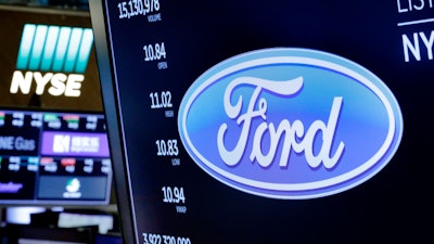 This April 23, 2018 photo shows the logo for Ford above a trading post on the floor of the New York Stock Exchange.
