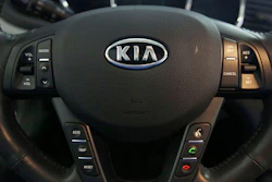 This Oct. 5, 2012, file photo shows a Kia optima's steering wheel inside of a Kia car dealership in Elmhurst, Ill.
