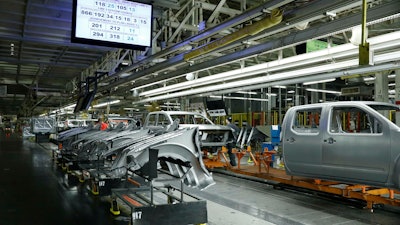 In this March 19, 2018, file photo truck chassis roll down an assembly line at Nissan's Canton, Miss., assembly plant.