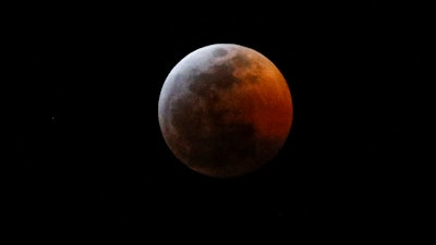 The moon during a total lunar eclipse, seen from Los Angeles, Sunday Jan. 20, 2019.