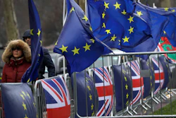 Flags tied to railings outside parliament in London, Thursday, Jan. 24, 2019.