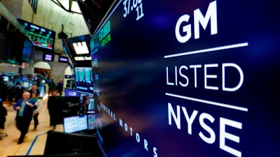 In this April 23, 2018, file photo, the logo for General Motors appears above a trading post on the floor of the New York Stock Exchange.