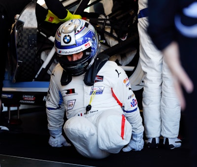 Alex Zanardi practices driver changes with team members in the BMW M8 GTE as he prepares for the IMSA 24 hour race at Daytona International Speedway, Friday, Jan. 25, 2019.
