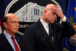 Acting Attorney General Matt Whitaker wipes his brow after announcing an indictment of Chinese telecommunications companies, Monday, Jan. 28, 2019.