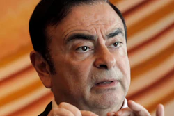 In this April 20, 2018, file photo, then-Nissan Chairman Carlos Ghosn speaks during an interview in Hong Kong.
