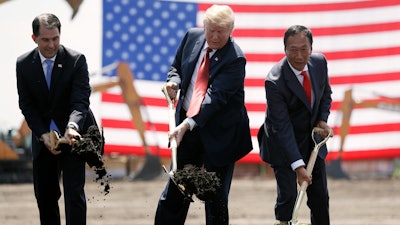 In this June 28, 2018, file photo, President Donald Trump, then-Wisconsin Gov. Scott Walker and Foxconn Chairman Terry Gou participate in a groundbreaking event for the new Foxconn facility in Mt. Pleasant, Wis.