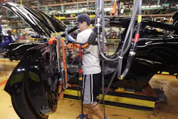 A United Auto Workers assemblyman works on the Ford Mustang at the Flat Rock Assembly Plant in Flat Rock, Mich.