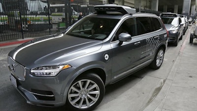 In this Dec. 13, 2016 photo, an Uber driverless car heads out for a test drive in San Francisco.