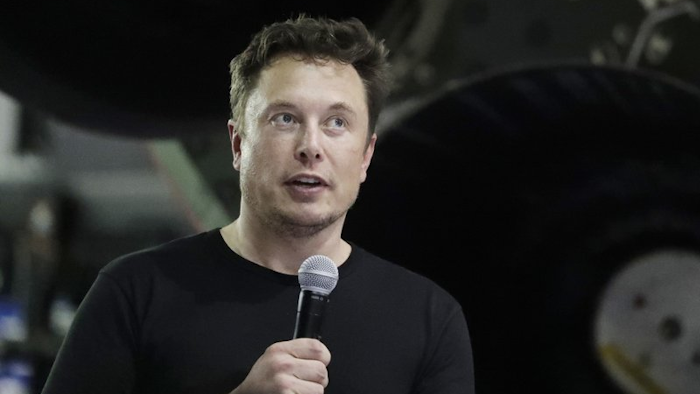 In this Sept. 17, 2018, file photo, Elon Musk speaks after announcing Japanese billionaire Yusaku Maezawa as the first private passenger on a SpaceX trip around the moon in Hawthorne, Calif.