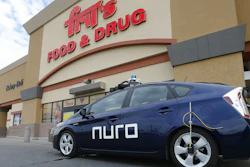 A self-driving Nuro vehicle parks outside a Fry's supermarket as part of a pilot program for grocery deliveries Thursday, Aug. 16, 2018, in Scottsdale, Ariz.