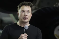 In this Sept. 17, 2018, file photo, Elon Musk speaks after announcing Japanese billionaire Yusaku Maezawa as the first private passenger on a SpaceX trip around the moon in Hawthorne, Calif.