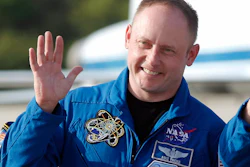 In this Tuesday, March 29, 2011, file photo, space shuttle Endeavour crew member Mike Fincke waves to onlookers after arriving for a practice countdown at Kennedy Space Center in Cape Canaveral, Fla.