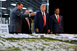 In this June 28, 2018 photo, President Donald Trump takes a tour with Foxconn chairman Terry Gou and CEO of SoftBank Masayoshi Son in Mt. Pleasant, Wis.