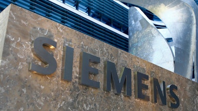 This June 24, 2016, file photo shows the Siemens logo at its headquarters in Munich.