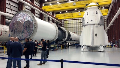 In this Dec. 18, 2018, file photo, SpaceX's Dragon capsule sits in a SpaceX hangar in Cape Canaveral, Fla.