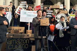 This Dec. 12, 2018, file photo shows State Assemblyman Ron Kim as he speaks at a rally opposing New York's deal with Amazon on the steps of New York's City Hall.