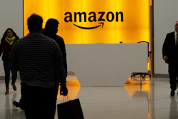 People walk into the lobby for Amazon offices Thursday, Feb. 14, 2019, in New York.