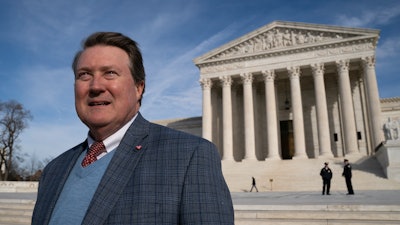 Mitch Hungerpiller of Birmingham, Ala., who invented a computerized system to automate the processing of returned mail, visits the Supreme Court in Washington, on Feb. 14, 2019.