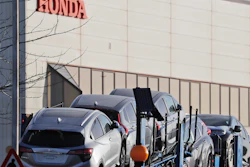 Cars leave the Honda factory in Swindon, England, Tuesday, Feb. 19, 2019.