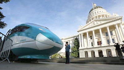 In this Feb. 26, 2015, file photo, a full-scale mock-up of a high-speed train is displayed at the Capitol in Sacramento, Calif.