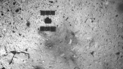 This image released by the Japan Aerospace Exploration Agency shows the shadow of the Hayabusa2 spacecraft after its successful touchdown on the asteroid Ryugu, Friday, Feb. 22, 2019.